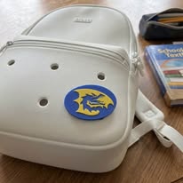Charm on a Crocs backpack